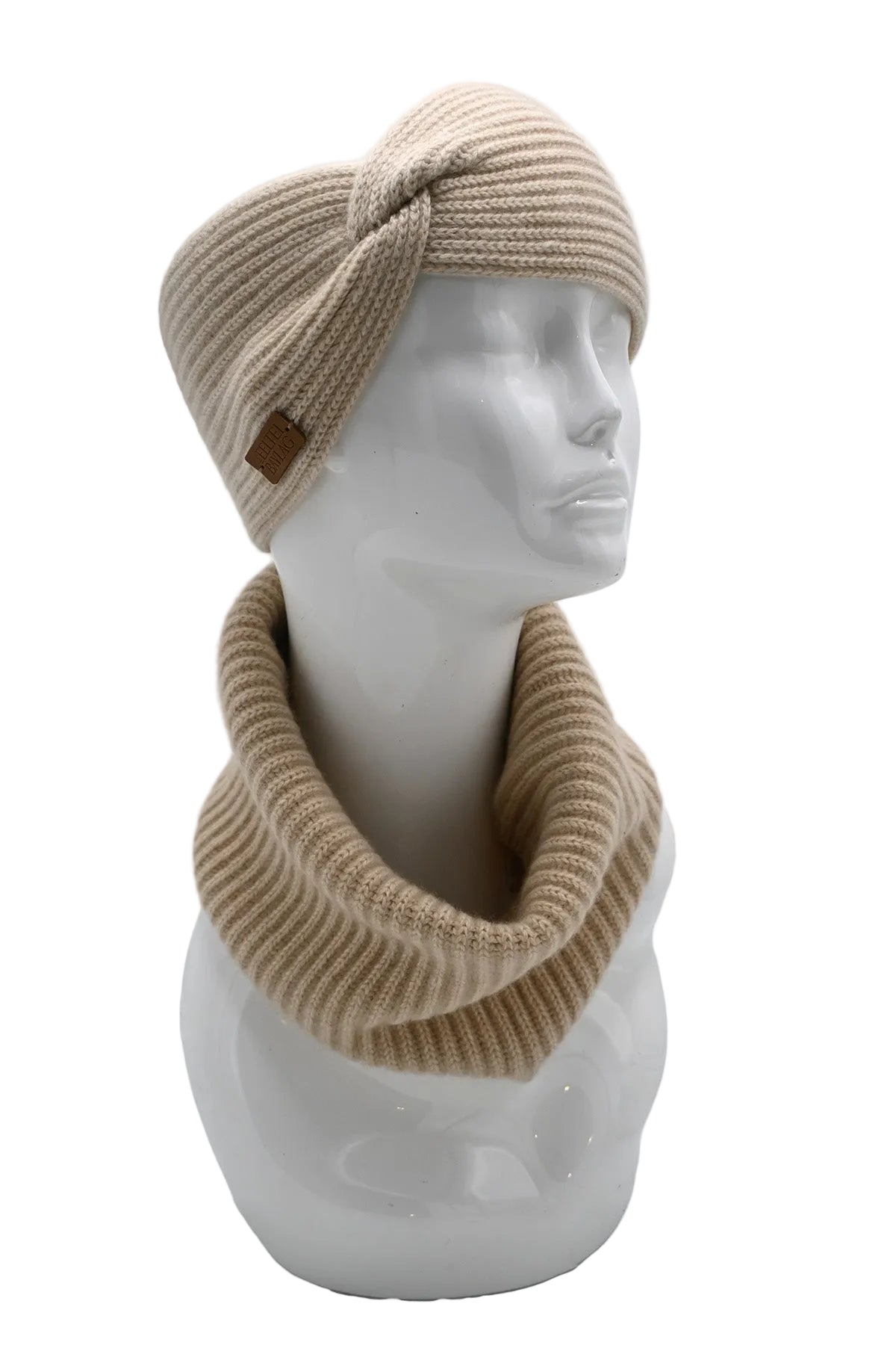 Mannequin head wearing a beige knitted cashmere headband and scarf on a white background